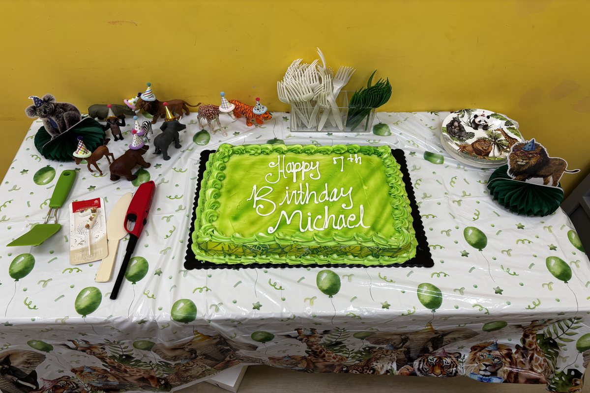 A jungle-themed birthday cake and party table set up for a milestone celebration at Hyper Kidz Rockville